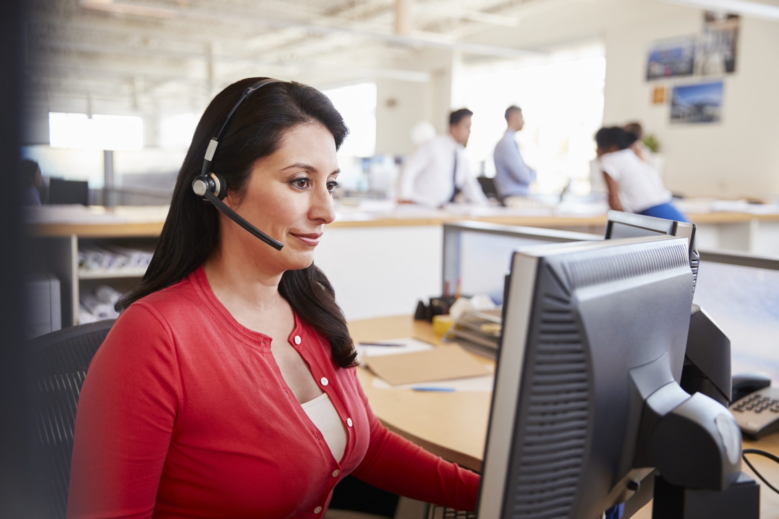 Hispanic woman working in a call centre Hispanic woman working in a call centre